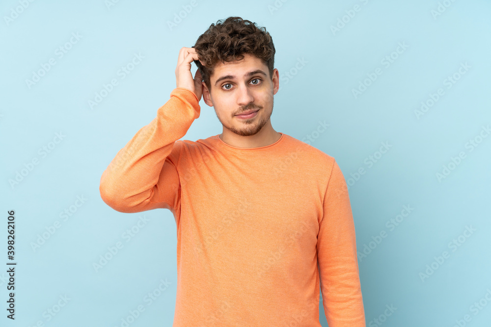 Caucasian man isolated on blue background with an expression of frustration and not understanding Caucasian man isolated on blue background with an expression of frustration and not understanding