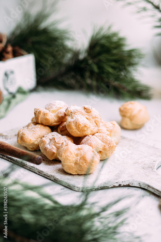 Profiteroles with custard on the table. New Year's dessert