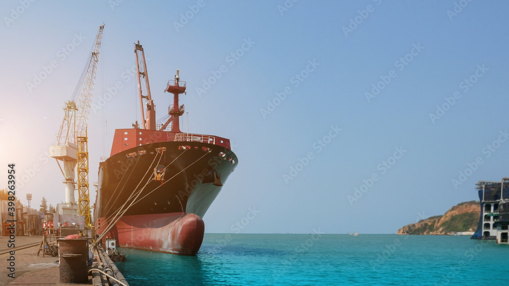 Cargo ship Moored and Mooring bollard with a fixed rope on the front of Bulbous bow ship Logistics and Transportation of international Container Cargo ship in the sea on blue sky