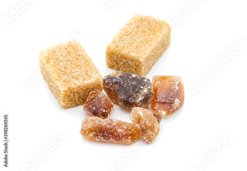 brown sugar and raw cubes isolated on white background