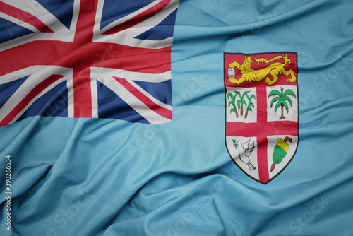 waving colorful national flag of Fiji .