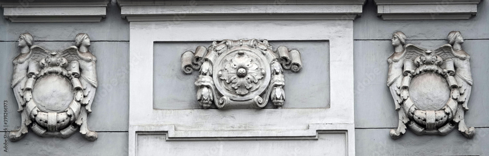 A bas-relief on the facade of a building with different subjects