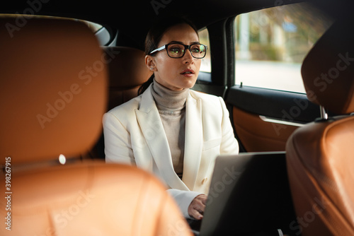 Amazing concentrated business woman sitting in a car © Drobot Dean
