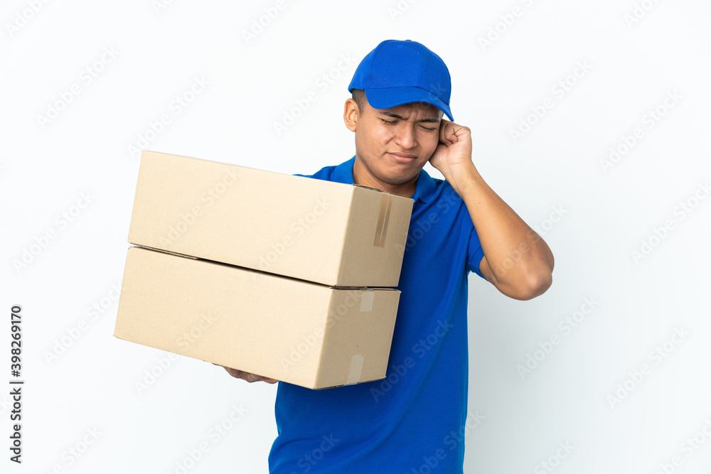 Delivery Ecuadorian man isolated on white background frustrated and covering ears Delivery Ecuadorian man isolated on white background frustrated and covering ears
