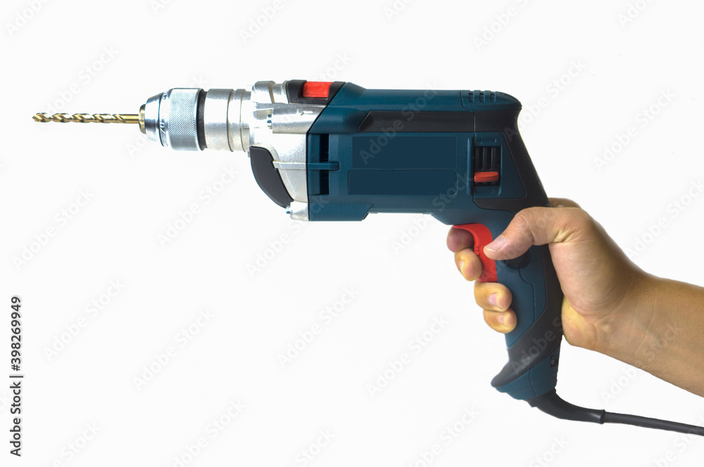 Power tool in a man's hand on a white background. Electric drill with drill Power tool in a man's hand on a white background. Electric drill with drill
