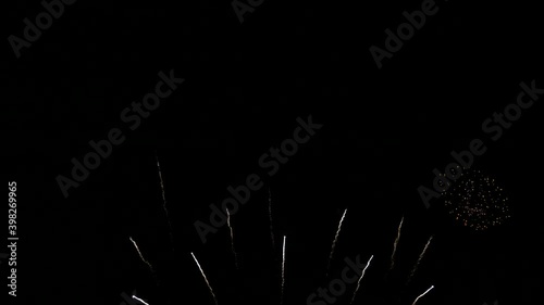 4K. loop seamless of real beautiful fireworks background during new year's eve countdown celebration, real golden shining fireworks festival in the sky at night with colorful. glowing fireworks show.