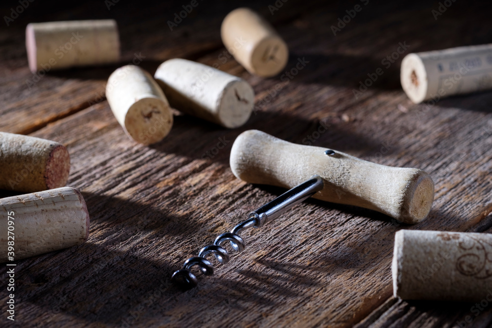 Wine corks with corkscrew on wooden background. Celebrate. Party. Bar.