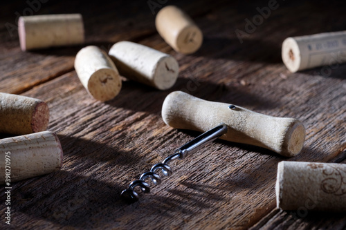 Wine corks with corkscrew on wooden background. Celebrate. Party. Bar.