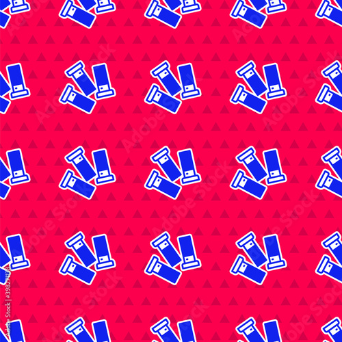 Blue Cartridges icon isolated seamless pattern on red background. Shotgun hunting firearms cartridge. Hunt rifle bullet icon. Vector.
