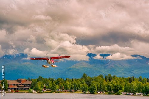 Canvas Print Seaplane flies over Lake Hood in Anchorage Alaska