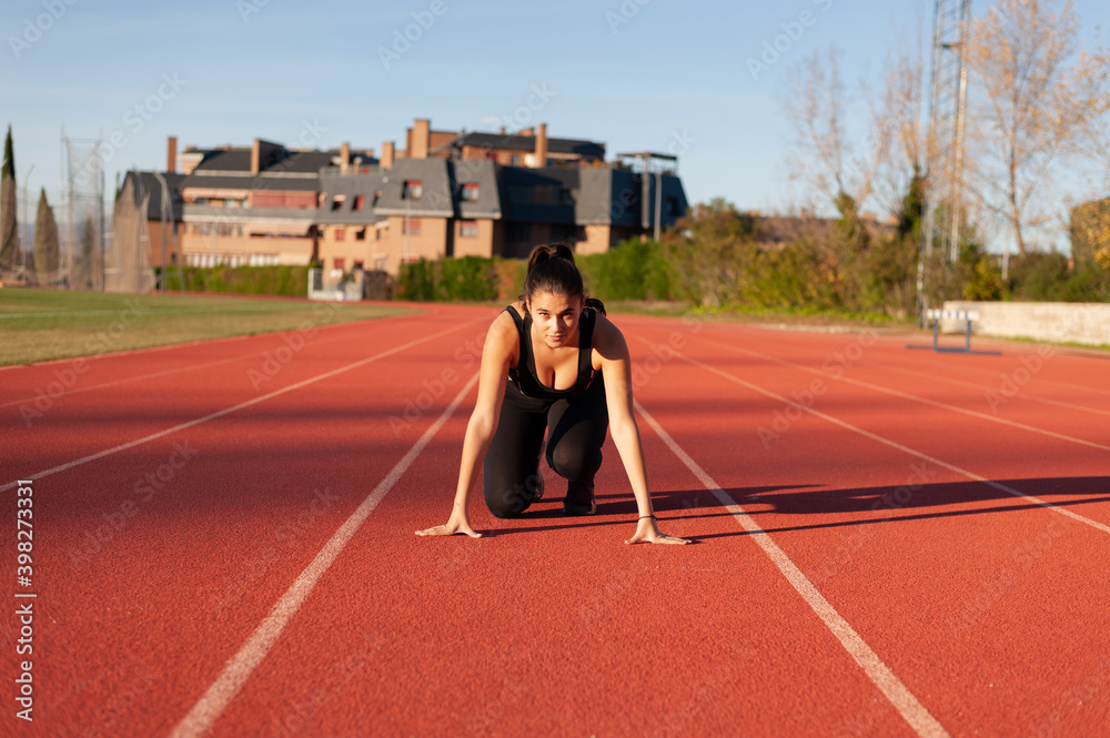 young sportsman on the running track young sportsman on the running track