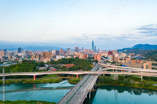Taipei City Aerial View - Asia business concept image, panoramic modern cityscape building bird’s eye view under sunrise and morning blue bright sky, shot in Taipei, Taiwan © yaophotograph