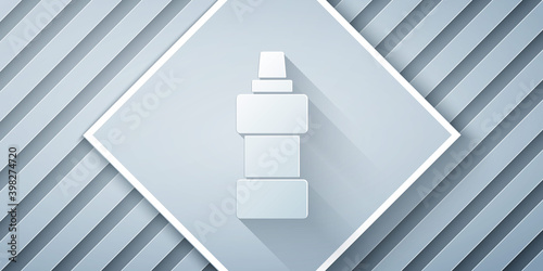 Paper cut Plastic bottle for laundry detergent, bleach, dishwashing liquid or another cleaning agent icon isolated on grey background. Paper art style. Vector.