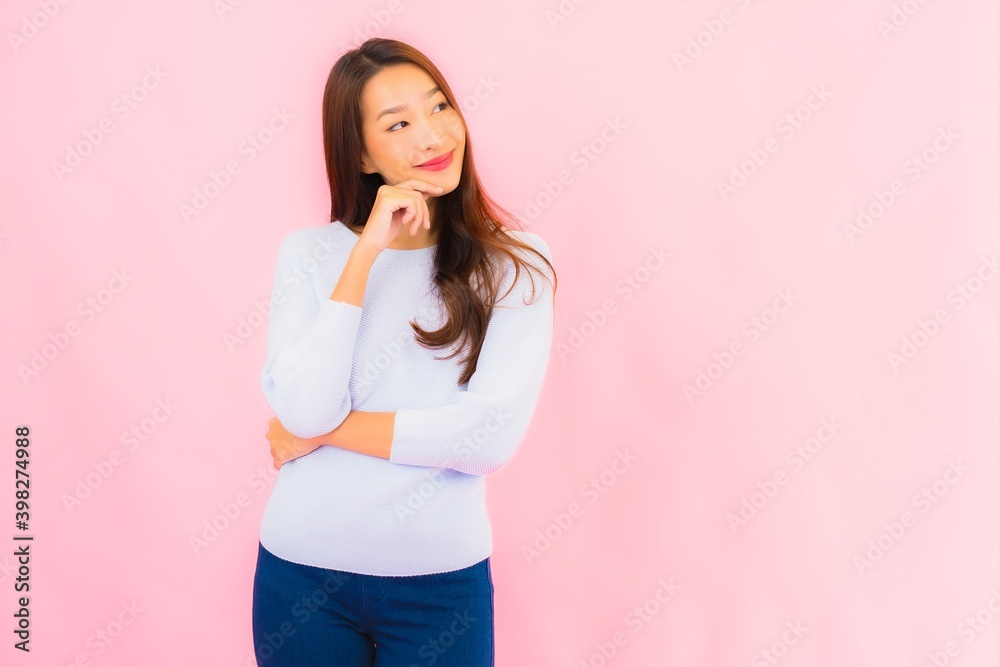 Portrait beautiful young asian woman smile with action on pink background Portrait beautiful young asian woman smile with action on pink background