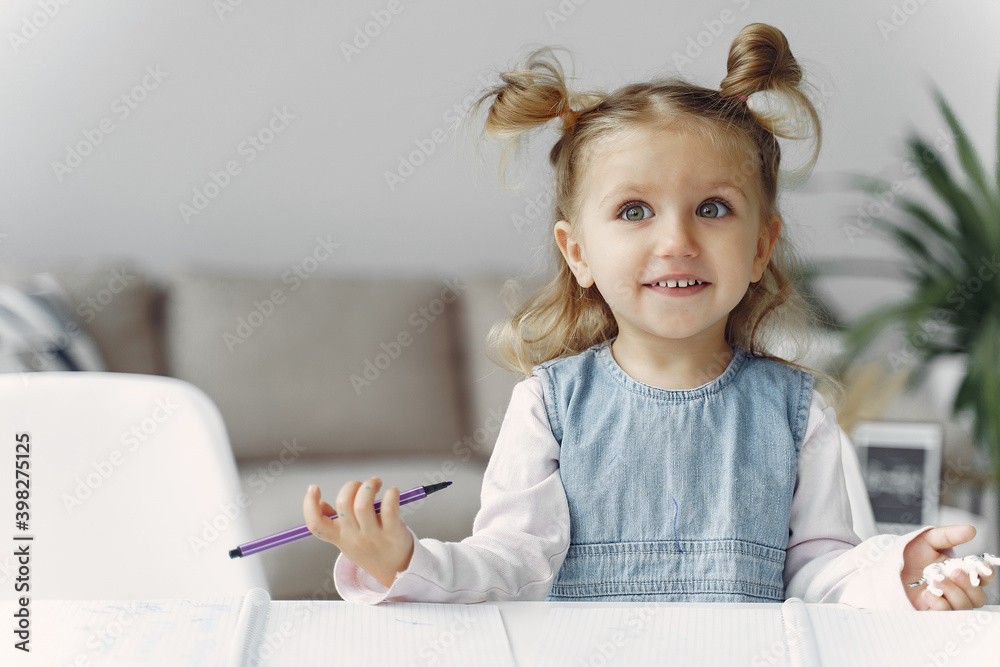 Child with a books. Girl sitting on a table. Kid in a class. Child with a books. Girl sitting on a table. Kid in a class.