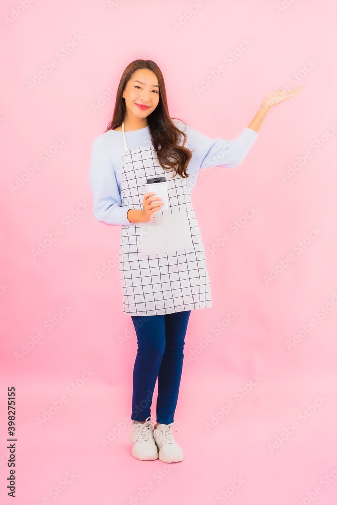 Portrait beautiful young asian woman in kitchen wear with apron Portrait beautiful young asian woman in kitchen wear with apron