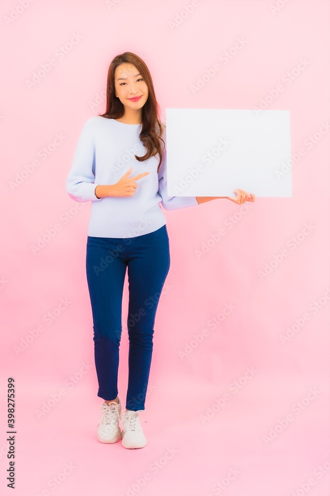 Portrait beautiful young asian woman show empty white billboard for text Portrait beautiful young asian woman show empty white billboard for text