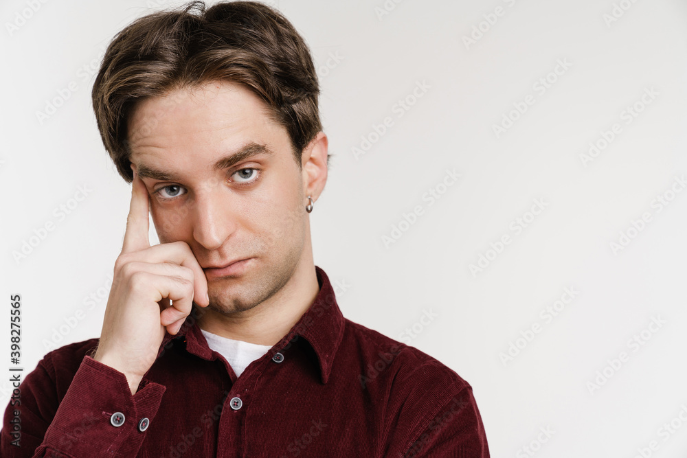 Handsome serious guy posing and looking at camera Handsome serious guy posing and looking at camera