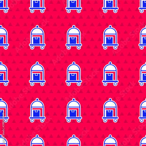Blue Hotel luggage cart with suitcase icon isolated seamless pattern on red background. Traveling baggage sign. Travel luggage icon. Vector.