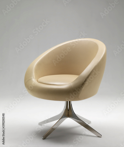 Modern armchair on neutral background