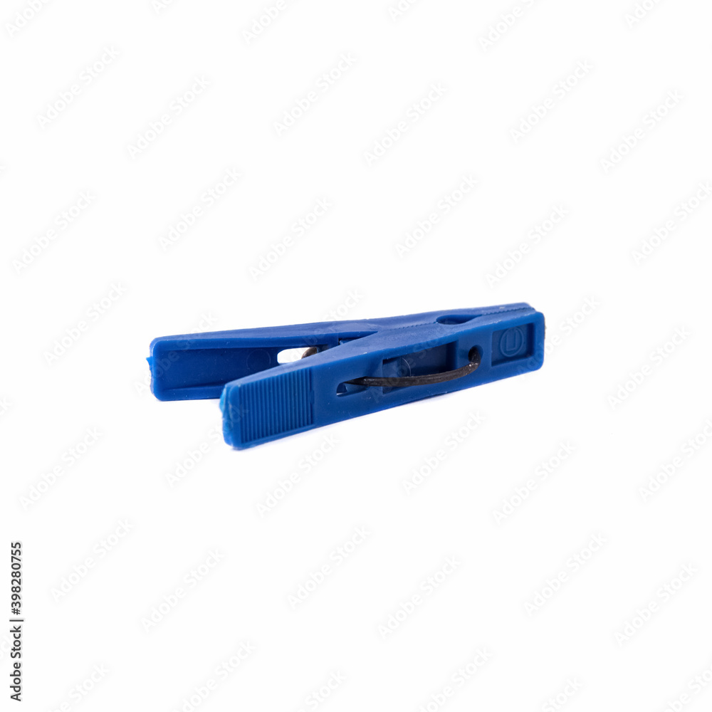 Blue plastic clothespin isolated on a white background Blue plastic clothespin isolated on a white background