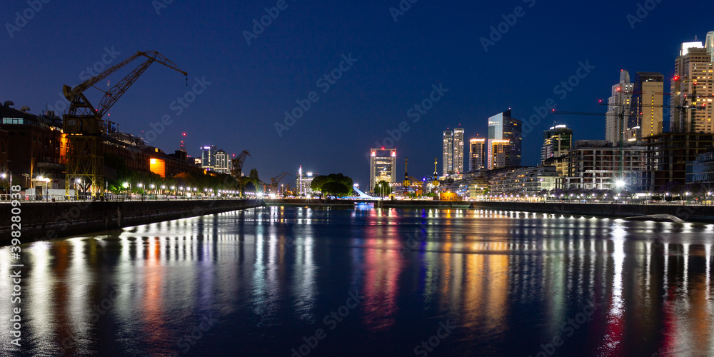 Fototapeta premium Tourism in Buenos Aires. Puerto Madero at night. The most modern and luxurious neighborhood in Buenos Aires shows all its glamor at night. 
