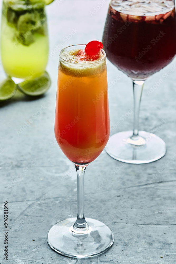 Set of various cocktails with flowers and fruits on white background Set of various cocktails with flowers and fruits on white background