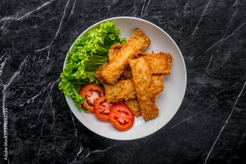 Breaded fried fish with vegetable