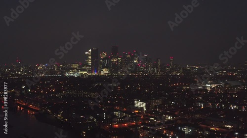 Wallpaper Mural Dolly forward drone shot towards Canary wharf skyscrapers at night Torontodigital.ca