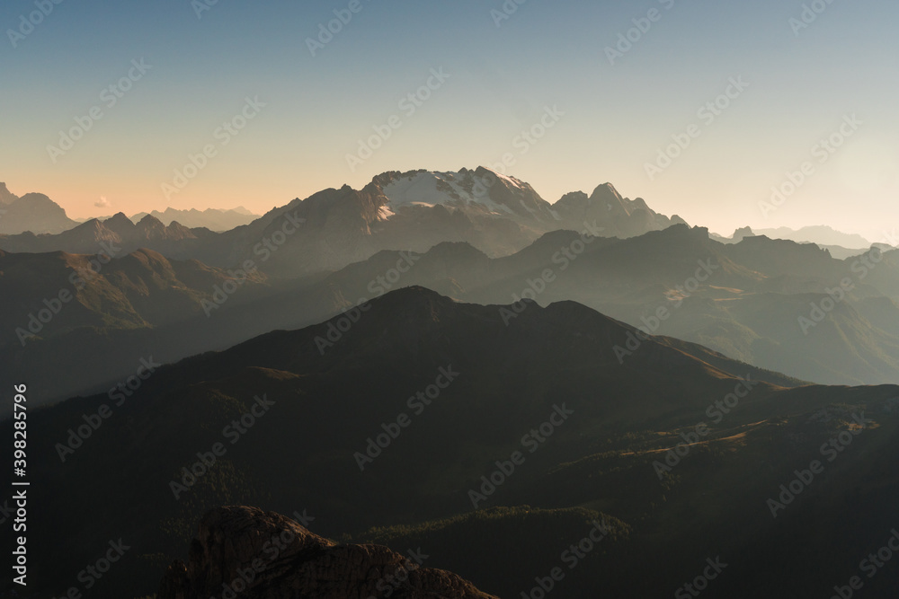 Obraz premium Beautiful scenic views of rocks and shadows at sunset in the Dolomites. Gorgeous stunning mountains in the golden hour. Italy