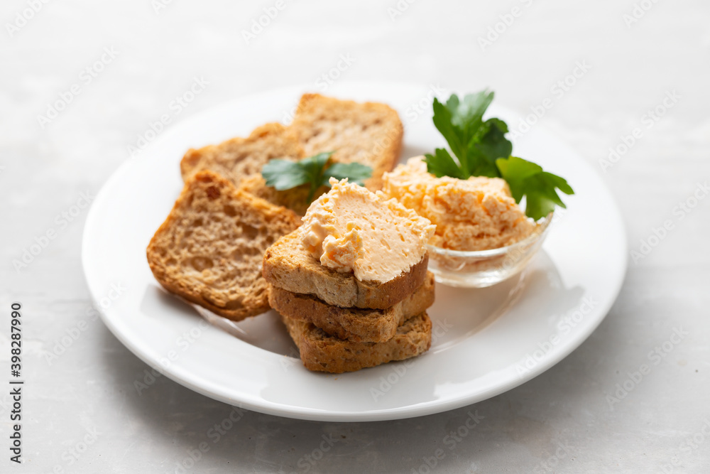 toasts with fish pate on white plate toasts with fish pate on white plate