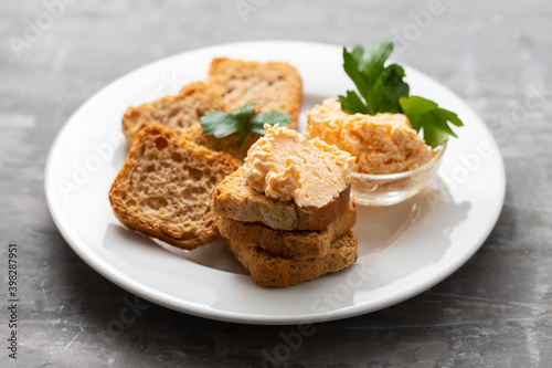 toasts with fish pate on white plate
