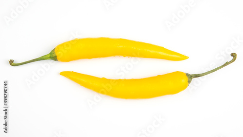 yellow hot chili on a white plate. Pepper. Vegetable vitamin food.