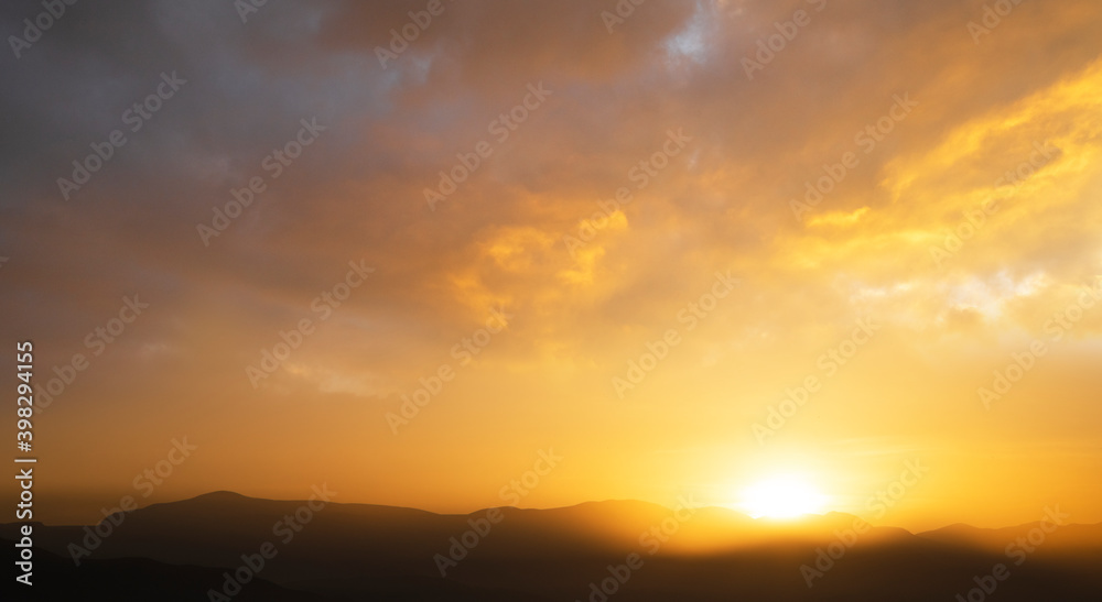 Beautiful sunrise in the mountains. Nature background.