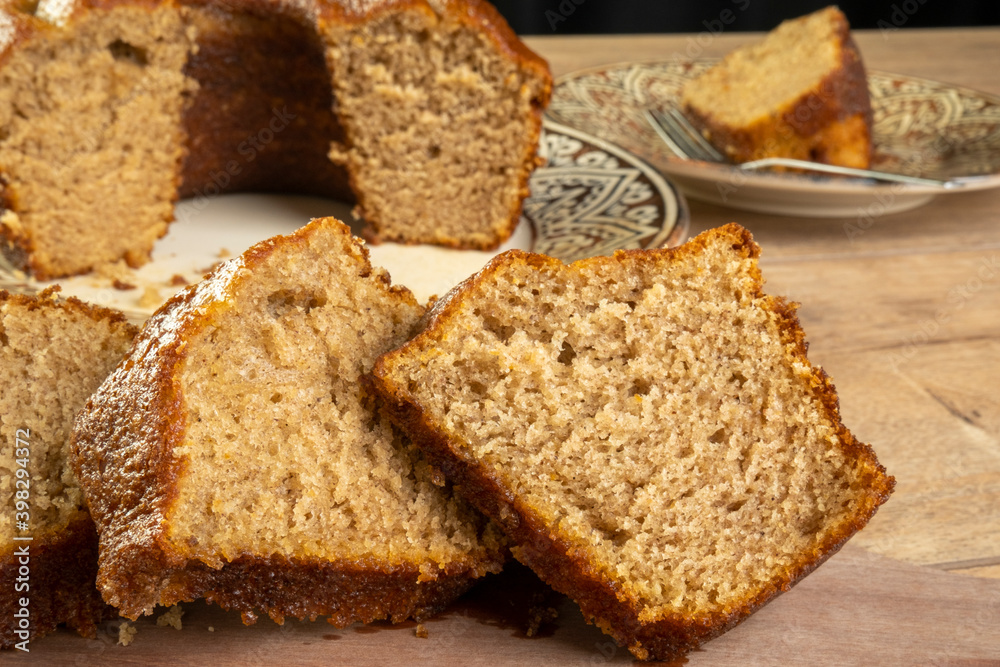 some slices of a banana cake on wooden table some slices of a banana cake on wooden table