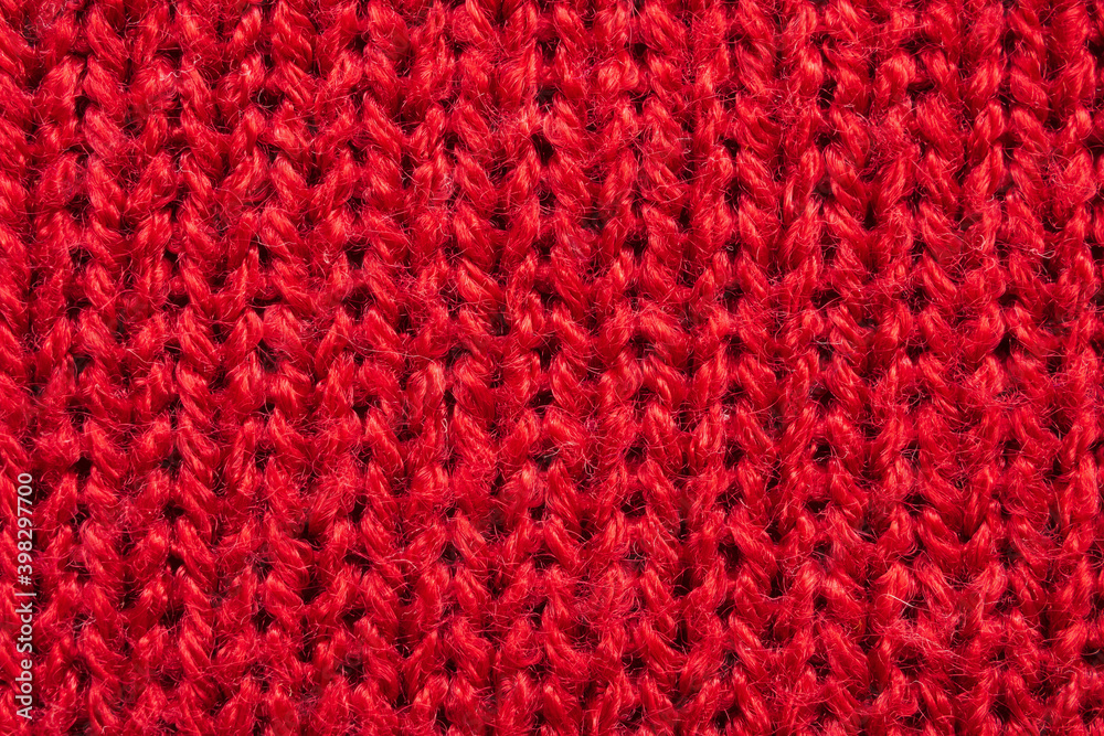 Red knitted wool texture background