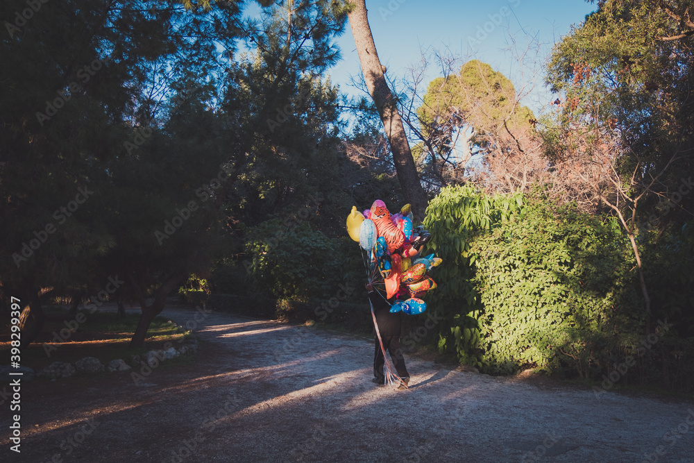 Street balloon vendor sells his things in the National Garden in the center  of Athens Stock Photo | Adobe Stock