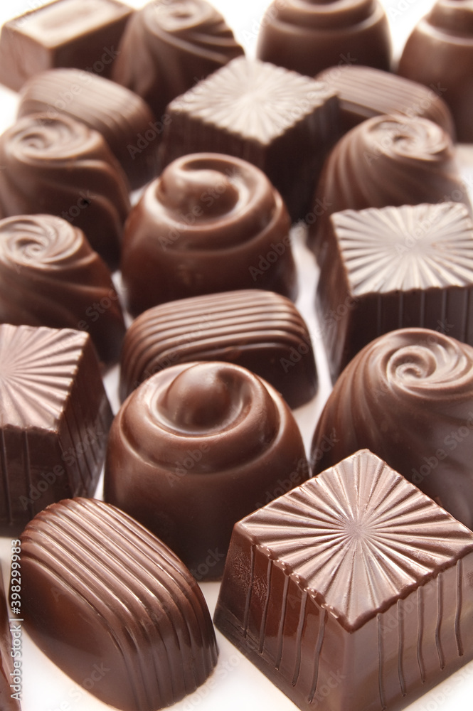 Fototapeta premium Different chocolate candies over white background