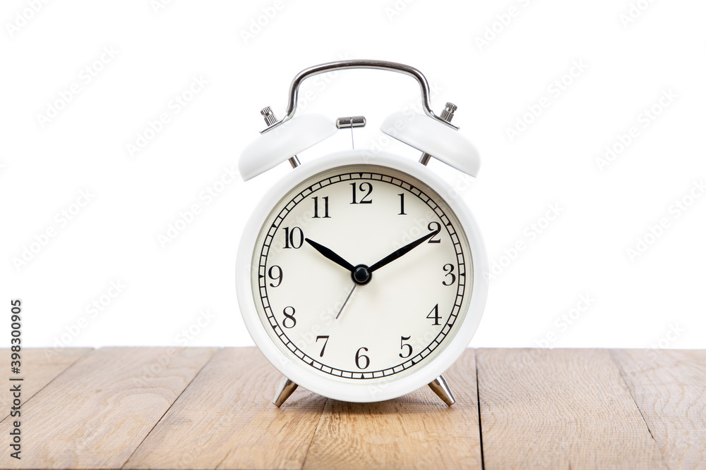 Retro alarm clock on wooden table . Old fashioned alarm clock Retro alarm clock on wooden table . Old fashioned alarm clock