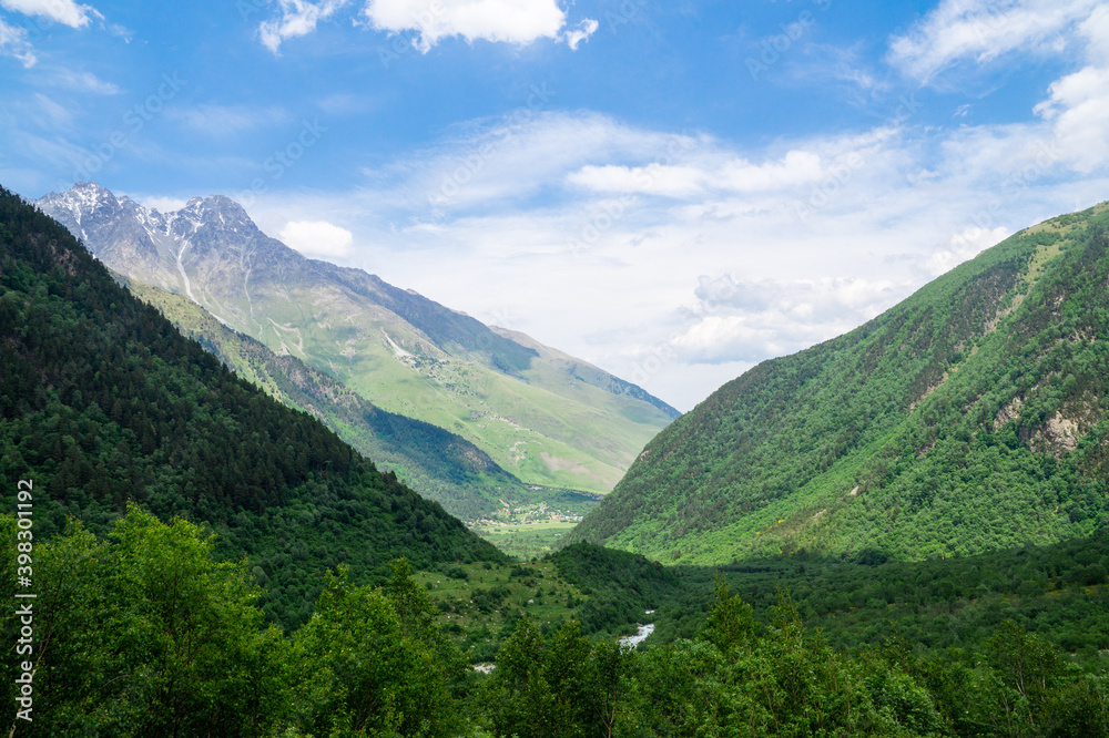 A mountain valley opens up between the Caucasus mountains