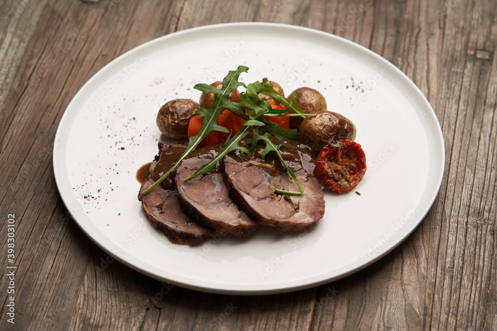 Baked pork and potatoes. Pork meat and vegetables Baked pork and potatoes. Pork meat and vegetables
