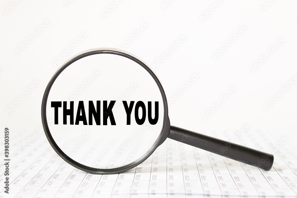 words THANK YOU in a magnifying glass on a white background. business concept words THANK YOU in a magnifying glass on a white background. business concept