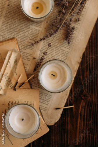 vintage paper and candles on a wooden table