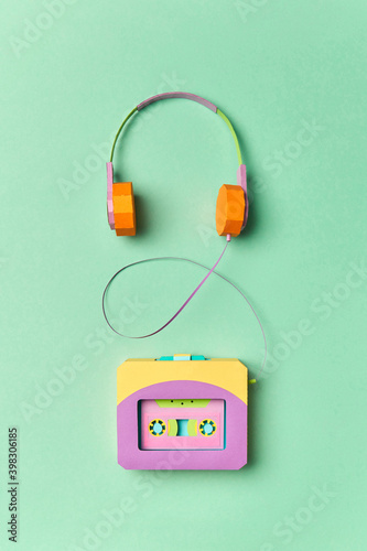 Papercraft portable player and earphones. photo