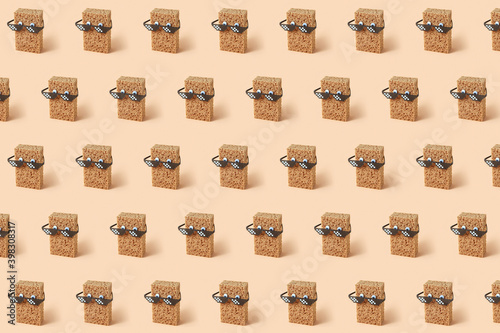 Creative pattern with sponges in pixel glasses. photo