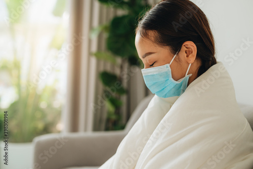 The asian woman has the flu. Dangerous infectious disease.