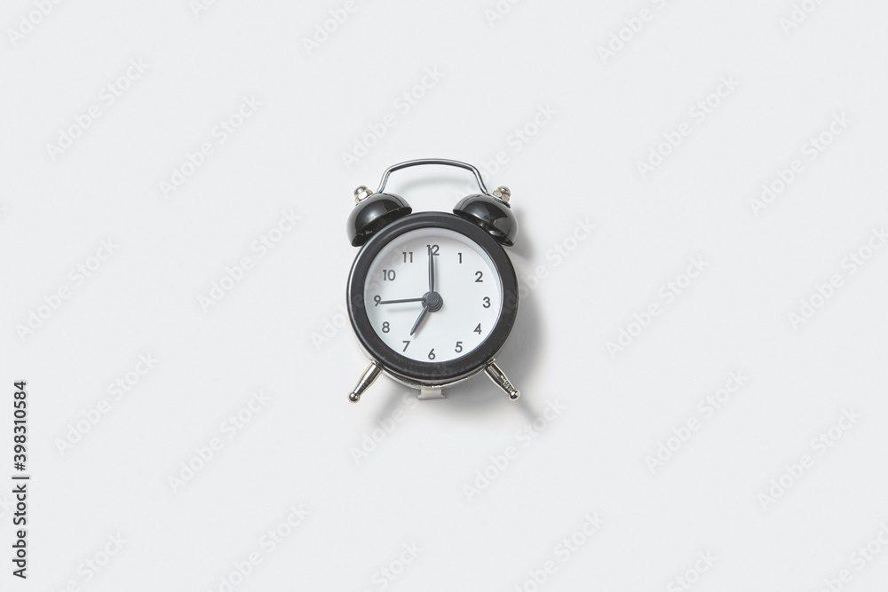 © Yaroslav Danylchenko/Stocksy - Retro alarmclock is showing seven.