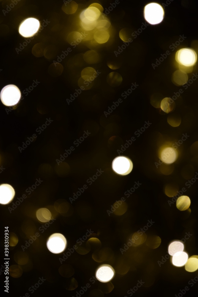 Fototapeta premium Lights blurred bokeh abstract on dark background, rozmyte światełka na ciemnym tle lampki świąteczne