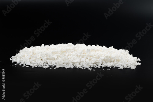 white artificial synthetic snow on black background