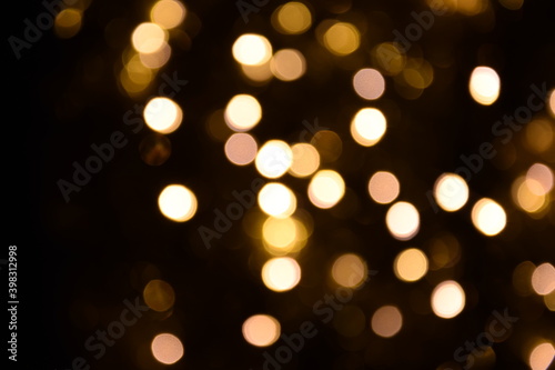 Lights blurred bokeh abstract on dark background, rozmyte światełka na ciemnym tle lampki świąteczne © Anna